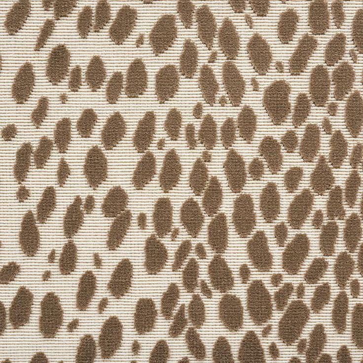 an animal print fabric with brown spots on it