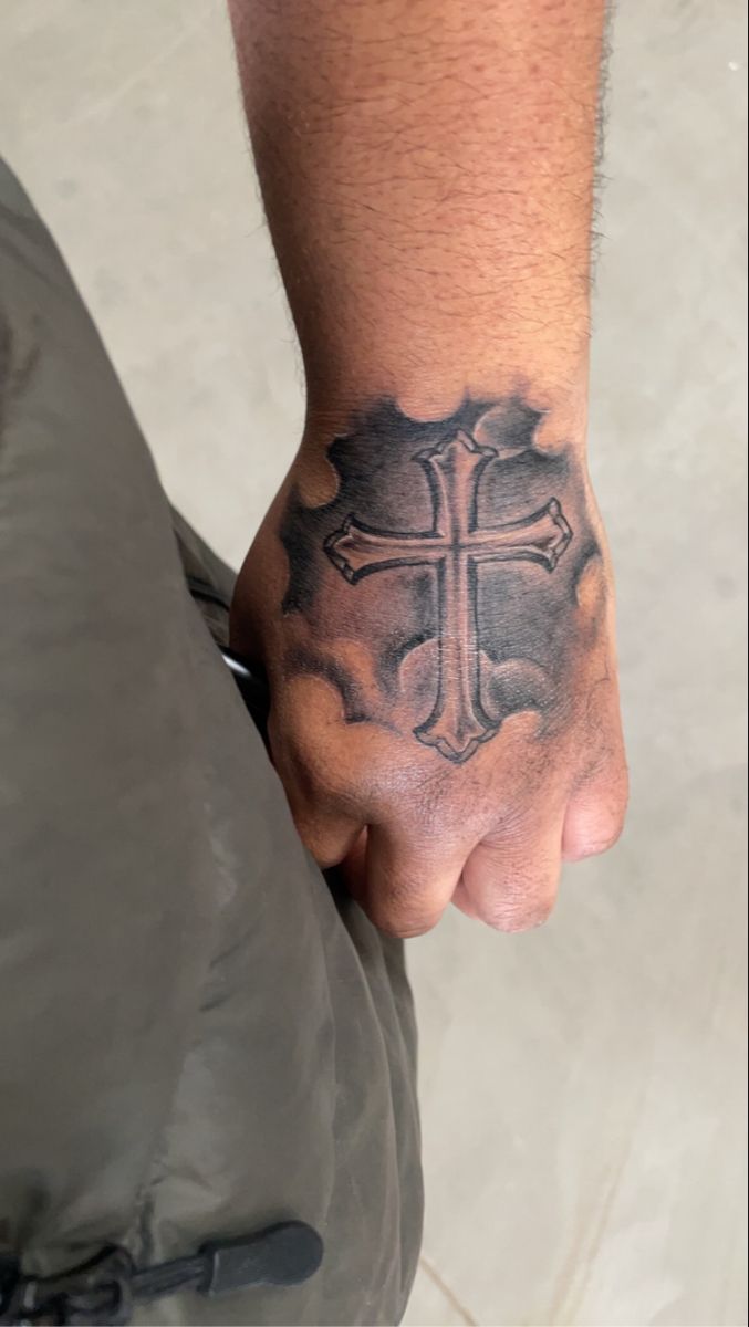 Lmao this my first tattoo Cross Hand Tattoo Men, Cloud Hand Tattoo, Cross With Clouds Tattoo, Hand Tattoos Cross, Cross On Hand Tattoo, Christian Hand Tattoo, God Hand Tattoo, Hand Cross Tattoo, Small Neck Tattoos Men