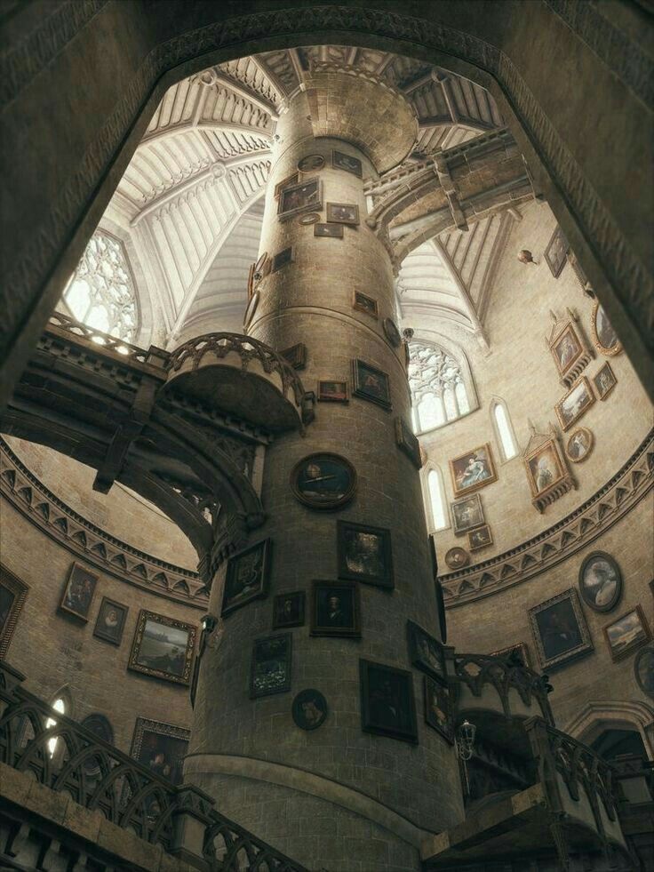 the inside of an old building with pictures on the walls and ceiling, looking up