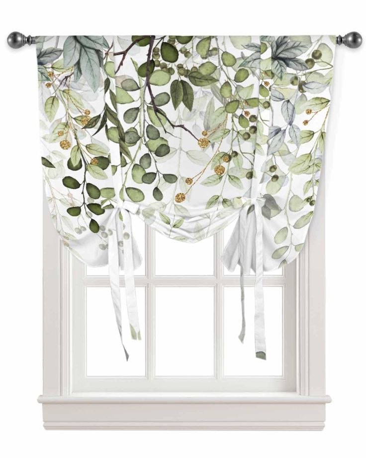 a white window curtain with green leaves on it