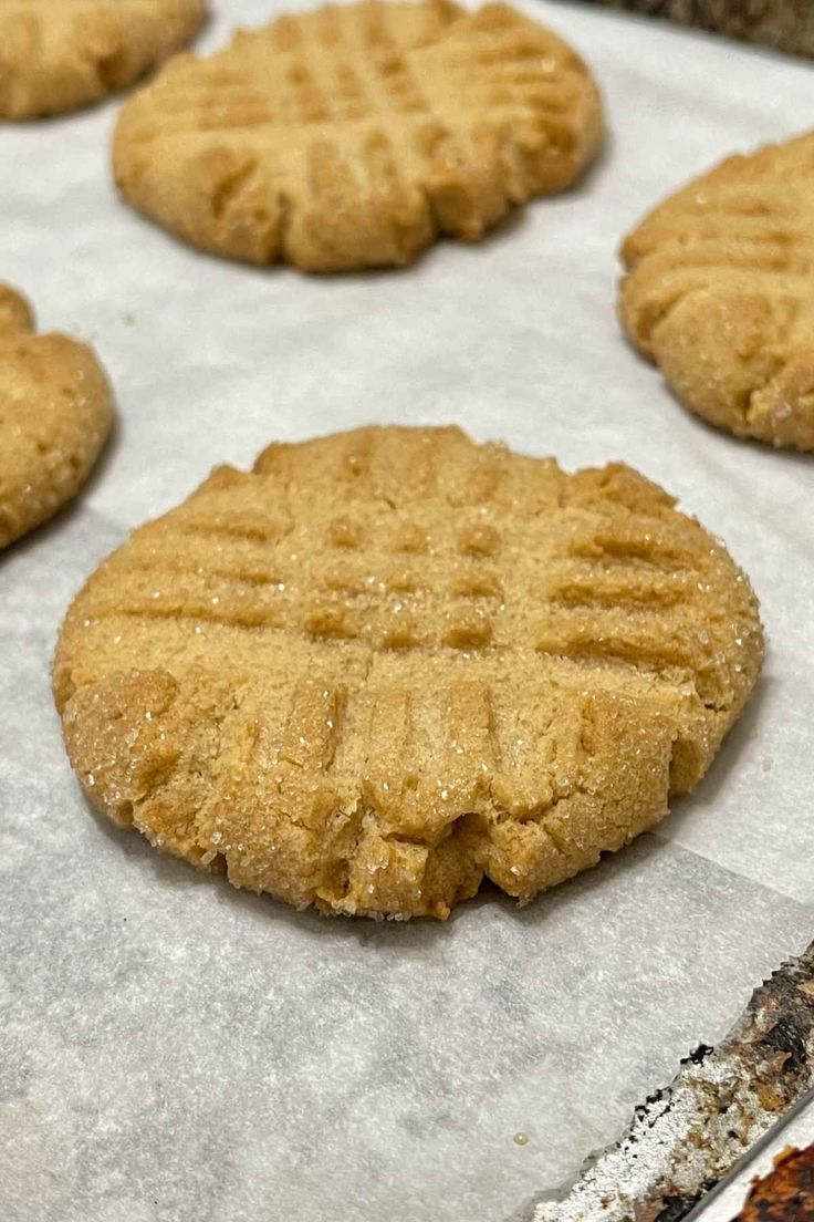 several cookies on a baking sheet ready to be baked