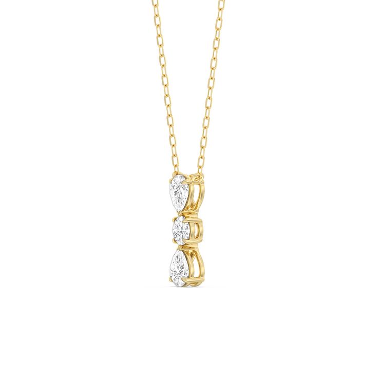 a gold necklace with three diamonds on the front and back, set in 18k yellow gold