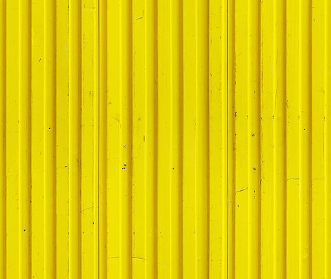 an image of a yellow wall that looks like it has been painted in different colors