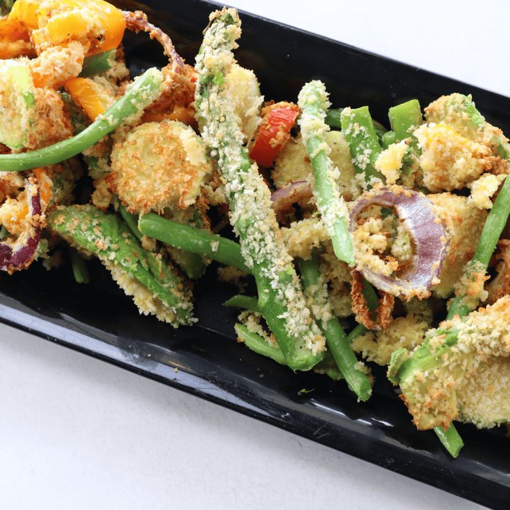 a black tray filled with green beans and fried food