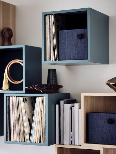 several shelves with various records on them