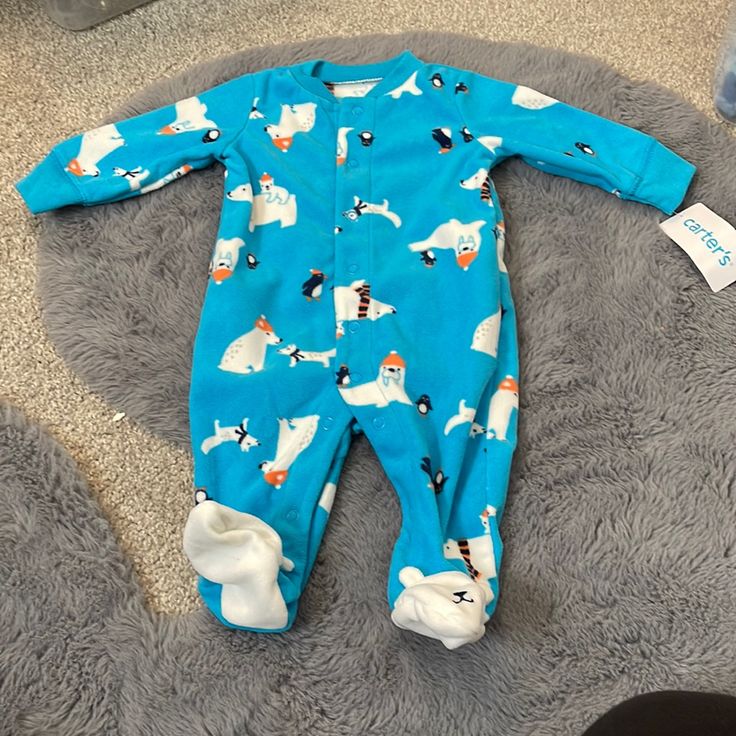 New With Tags * Polyester (100%) * Fall/Winter * Blue | White Polar Bears This Carter's Boys 1-Piece Footed Pajamas Is A Size 3 Months. The 1-Piece Footed Pajamas Is Pre-Owned In New With Tags Condition. Typically Carter's Blue | White Polar Bears 1-Piece Footed Pajamas Would Be Worn For Fall/Winter. Cute Winter Onesie For Sleepovers, Long Sleeve Onesie For Playtime In Winter, Blue Long Sleeve Onesie For Pajama Party, Blue Winter Sleepwear For Pajama Party, Blue Onesie For Winter Sleepover, Cute Blue Onesie For Sleepover, Blue Long Sleeve Onesie For Sleepover, Blue Winter Onesie For Sleepovers, Long Sleeve Onesie For Winter Playtime