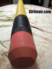 a yellow and black plastic tube sitting on top of a bed