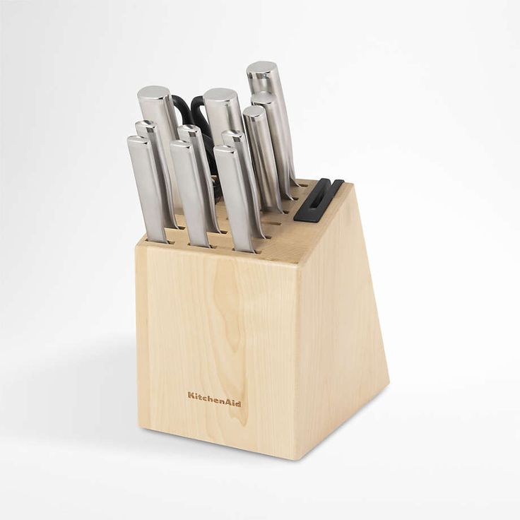 a wooden block with knives in it