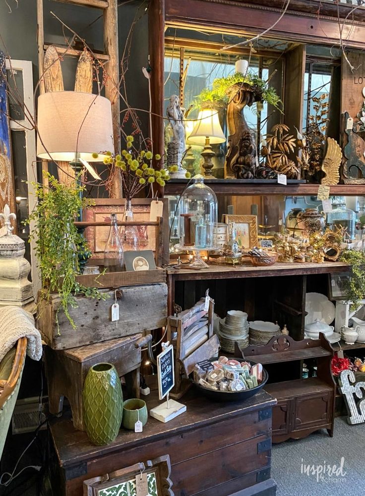 a room filled with lots of different types of furniture and decor on top of wooden shelves