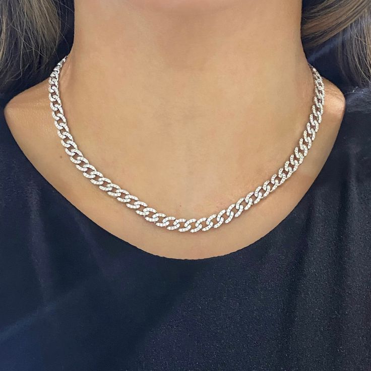 Get ready to sparkle with the Mini Gia Curb Link Pave Diamond Necklace! With 4.50 carats of pave diamonds set in a sleek curb link design, this necklace is the perfect blend of elegance and edginess. Elevate any outfit with this stunning piece. Metal: 18k White Gold / 18k Yellow Gold / 18k Rose Gold Round Brilliant Cut Natural Diamonds: Approx. 4.50 ctw G Color and VS-SI Clarity Diamonds Length: 15 inches Closure: Box Clasp Looking for a different length? Please email us. Diamond White Diamond Necklace With Curb Chain, Diamond White Necklace With Curb Chain, White Gold Cuban Link Necklace With Diamond Cut, White Gold Cuban Link Chain Necklace With Diamond Cut, Cubic Zirconia Curb Chain Necklace, Fine Jewelry White Gold Clavicle Chain Necklace, Silver Chain Necklace With Brilliant Cut, White Gold Clavicle Chain Necklace, White Gold Diamond Necklace With Chain