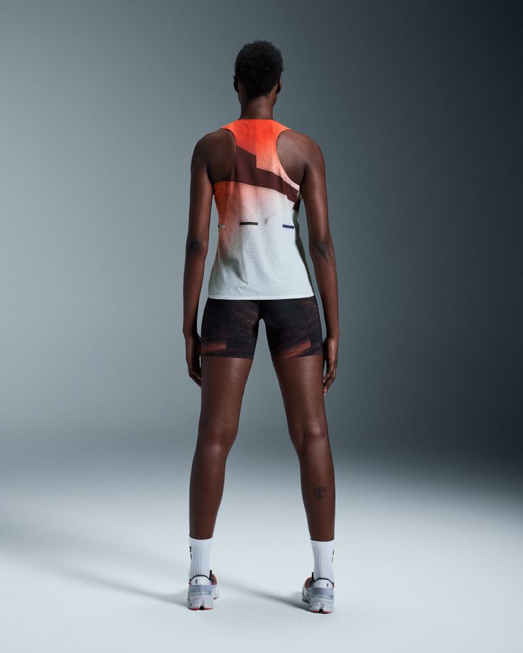 This ultralight race singlet is athlete-approved with a sleek racerback. Feel nothing but the wind from your stride | On Women's Race Singlet in Flame/White, Size: XS. Ultralight, racerback, performance running Running, Road Running, Marathon. Performance Running | Polyester Technical Racerback Summer Activewear, Summer Technical Racerback Activewear, Technical Summer Racerback Activewear, Breathable Stretch Activewear For Marathon, Reflective Functional Running Activewear, Summer Racerback Technical Activewear, White Mesh Back Activewear For Running, White Activewear With Mesh Back For Running, Sportswear Tank Top For Running With Racerback