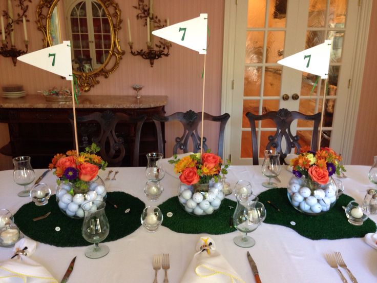 the table is set for easter dinner with eggs and flowers in vases on it