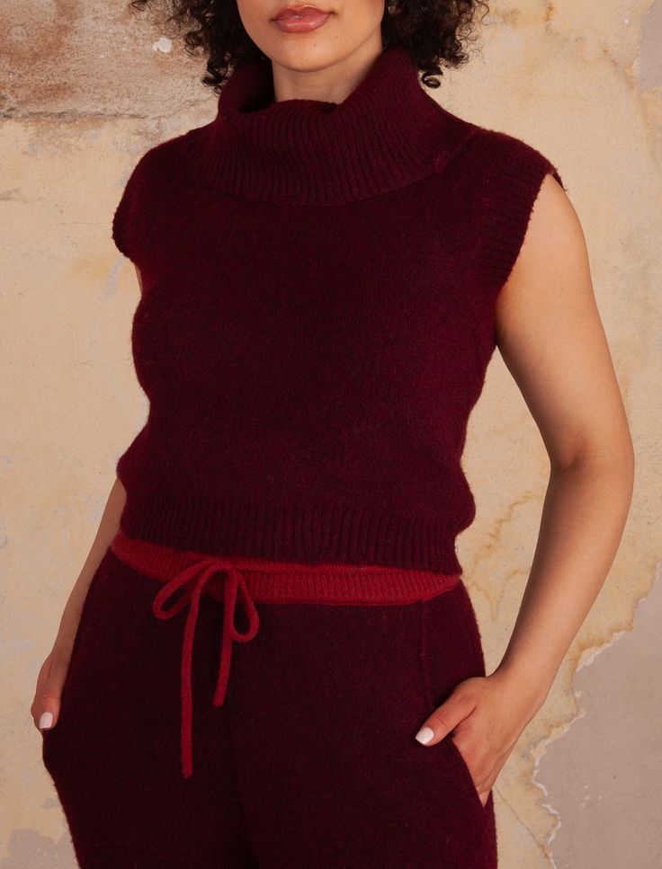 SLEEVELESS TURTLENECK TOP WITH DISTRESSED RIB SWEEP ACCENTS 92%RECYCLED POLYESTER 5%WOOL 3%ELASTAN Serena is 5'8" wearing a size S/M STYLE# M6227 Available sizes: S/M, M/L Sleeveless Turtleneck Top, Yarn Accessories, Sleeveless Turtleneck, Saddle Brown, Turtleneck Top, Outerwear Vest, Sweater Sale, Turtle Neck Top, Signature Style