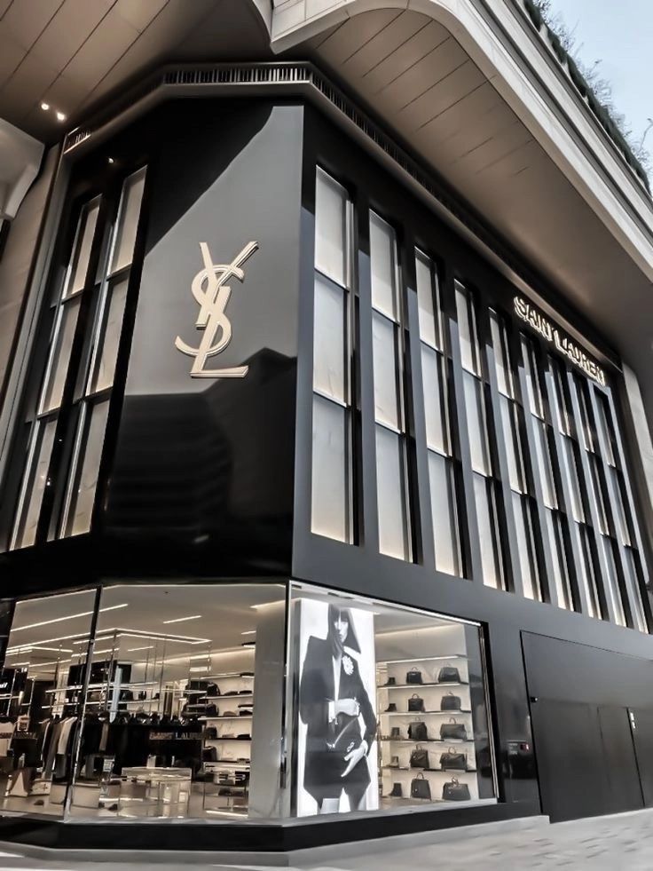 the store front of saint laurent's shoes is shown in black and white colors