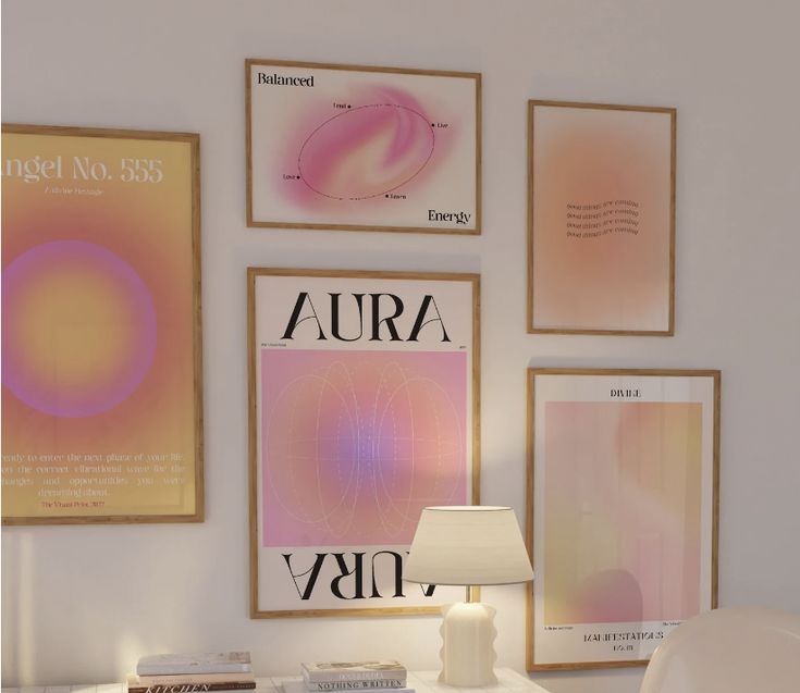 a white desk topped with a lamp next to posters