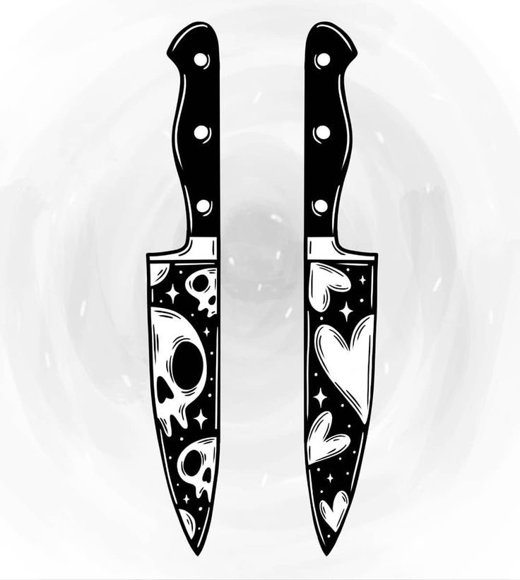 two black and white knives with skulls on them