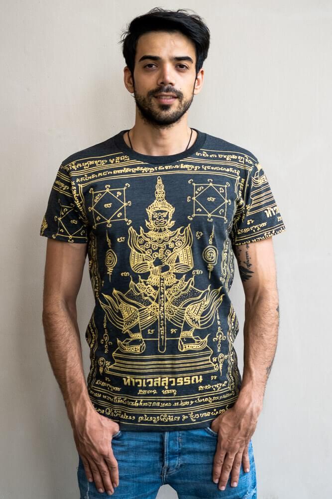 The Guardian shirt is a sak yant printed men's T-shirt adorned with traditional tattoo art in black and gold. Made of 100% Thai cotton this t-shirt is soft to the touch and kind on the skin. We recommend it for general wear and but for sunny days when the breathable fabric and short sleeves will help you feel cool. Pattern The main feature of the print is a depiction of  Thao Ves su van, also known as  the God of Giants . His name in Thai also appears on the shirt and this symbology is Traditional Short Sleeve T-shirt With Graphic Print, Printed Cotton T-shirt For Festivals, Traditional T-shirt With Graphic Print And Short Sleeves, Traditional Short Sleeve Graphic Print T-shirt, Guardian Tattoo, Black Hippy, Sak Yant Tattoo, Sak Yant, Fisherman Pants