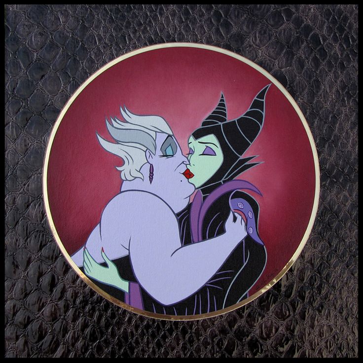 an image of maleficent and female witch kissing