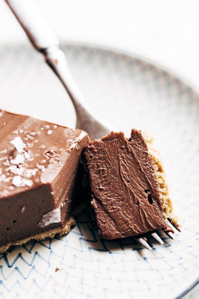 a piece of chocolate cake on a plate with a fork