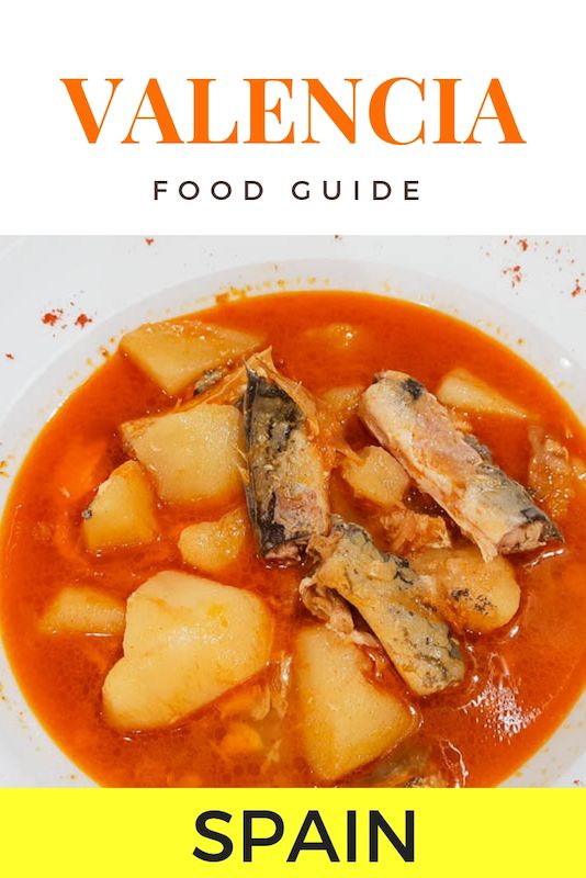 the spanish food guide for spain is shown in front of a white plate with red sauce