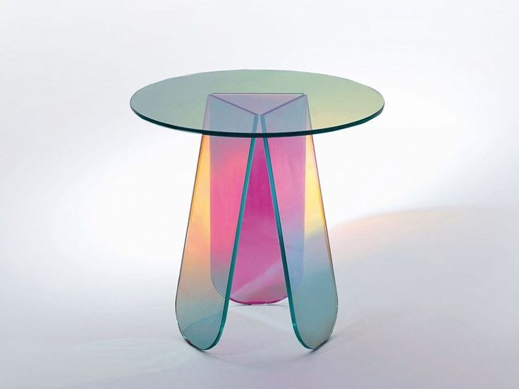 a colorful glass table with curved legs