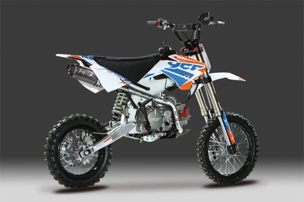 an orange and white dirt bike on a gray background