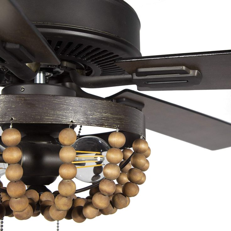 a ceiling fan with wooden beads hanging from it's blades