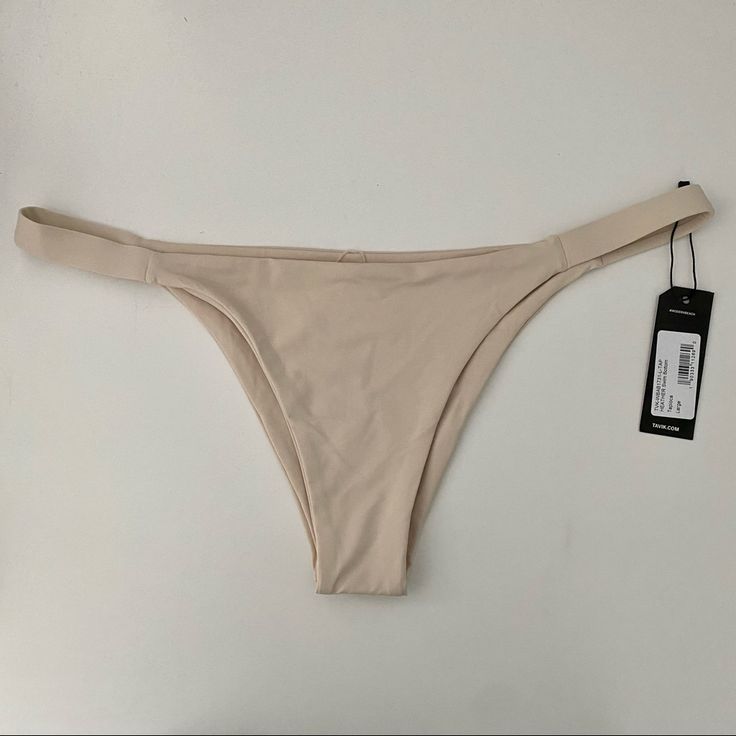 Tavik Swimwear Heather Bottom In Tapioca Cream Colored Super High Quality Swimwear Brand New In Perfect Condition, Never Worn, Still Has Sanitary Liner Size Large Brand Also Sold By Free People, Nordstrom, Madewell, Revolve, Asos, And Anthropologie Beige Lined Swimwear For Beach Season, Beige Lined Swimwear For Summer, Beige Lined Swimwear, Chic Beige Stretch Swimwear, Chic Beige Lined Swimwear, Beige Seamless Bottoms For Beach, Beige Lined Swimwear For Spring, Beige Seamless Stretch Swimwear, Beige Beachwear Bottoms For Pool