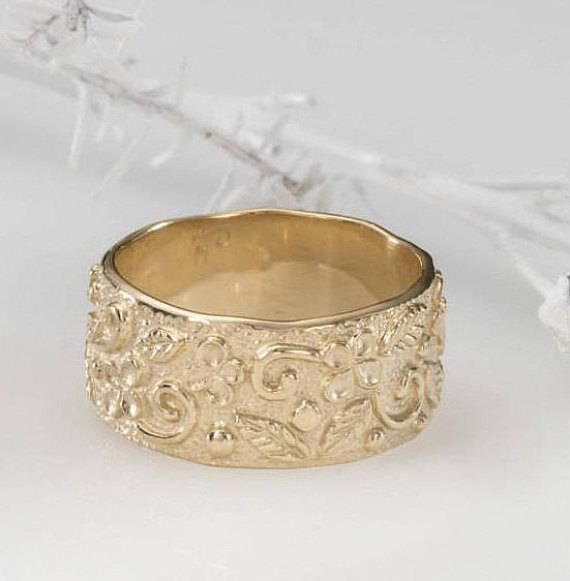 Gold Wedding Band, Antique Style Ring, Solid Gold Tube Ring A 14k gold wedding band, exclusive and elegant. Original Hand crafted, features romantic floral motifs engraved into the band. The ring has its thickness and weight, making it a noticeable piece. Designed and tested for maximum comfort to wear. A lovely ring that will last a lifetime. DETAILS: Ring width: 9.1 mm Thickness: 1.5 mm This ring is available in sizes 5-10 US size. Please select your preferred size. All my items are shipped gi Fine Jewelry Engraved Wide Band Wedding Ring, Luxury Wide Band Engraved Ring For Wedding, 14k Stamped Wide Band Ring For Wedding, Engraved Wide Band Ring With Decorative Detail For Wedding, Engraved Wide Band Ring With Decorative Band For Wedding, Engraved 14k Gold Wide Band Ring For Wedding, Wedding Engraved Ring With Decorative Wide Band, Heirloom 14k Gold Wide Band Wedding Ring, Heirloom Wide Band Engraved Ring For Wedding