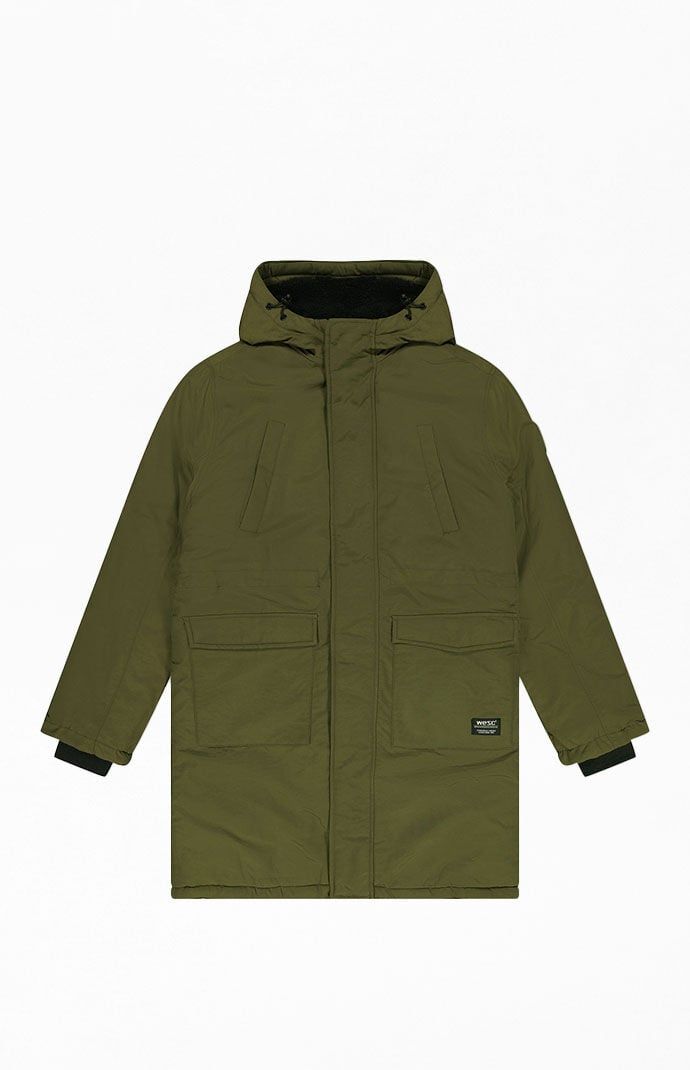 Conquer the cold with the WeSC Winter Parka, a heavyweight jacket designed to keep you warm and stylish through the harshest winter weather. Combining practical features with a sleek design, this parka is your ultimate winter essential.Heavyweight Winter Parka with Hood: Built for ultimate warmth and protection in freezing temperatures.Sherpa Lined: Plush Sherpa lining offers extra coziness and insulation.Adjustable Hood with Bungee Drawcord: Customize the fit to block out wind and snow.Fleece Lined Welt Chest Pockets: Provides warm, secure storage for your essentials.Fleece Lined Cargo Pockets at Waist: Extra warmth and practicality for carrying your gear.Vegan Logo Silicone Patch: Eco-friendly detailing that highlights your commitment to sustainable fashion.Signature WeSC Exterior Label: Functional Winter Streetwear Outerwear, Functional Winter Outerwear For Outdoor Activities, Urban Down Outerwear For Outdoor, Urban Solid Down Outerwear, Winter Utility Puffer Jacket For Outdoor, Waterproof Winter Parka For Outdoor Work, Winter Insulated Parka For Outdoor, Utility Style Winter Puffer Jacket For Outdoor, Winter Outdoor Insulated Parka