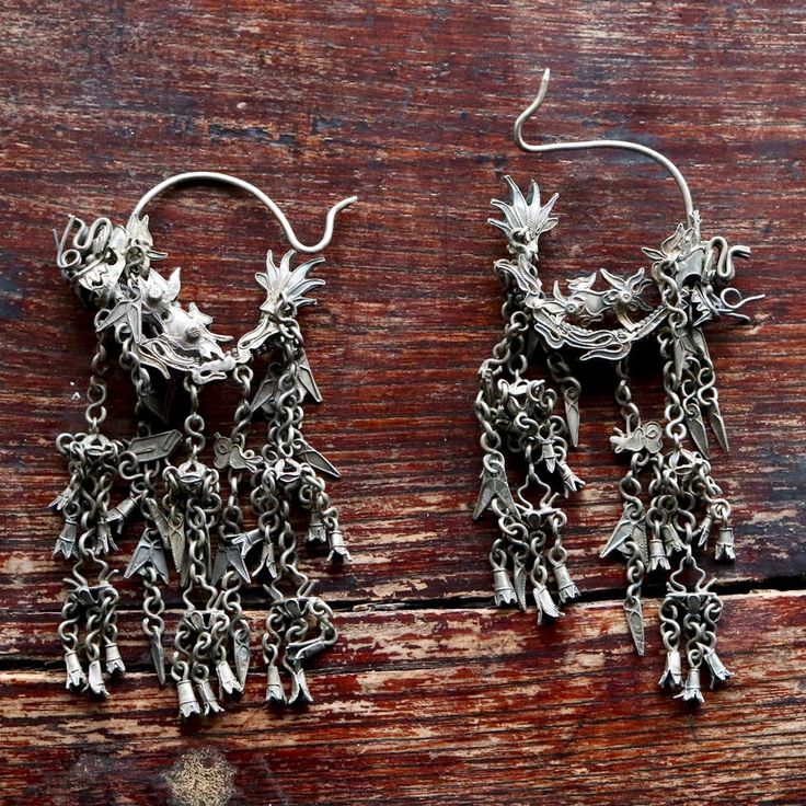 These dangle earrings are antiques that originate from the Qing Dynasty, where a noble woman would have worn an intricate design such as this for a special occasion.Antique stock, made by hand in the late 19th or early 20th century. Length 3 1/2 to 4 1/2 inches. Antique Earrings With Historical Design For Ceremonial Occasions, Antique Drop Earrings With Historical Design, Formal Drop Earrings With Historical Design, Antique Filigree Earrings For Ceremonial Occasions, Ornate Hallmarked Chandelier Dangle Earrings, Ornate Historical Design Earrings, Victorian Style Ceremonial Dangle Earrings, Victorian Style Ceremonial Earrings For Pierced Ears, Victorian Hallmarked Earrings For Ceremonial Occasions