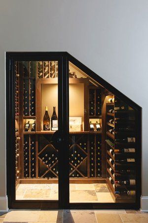 an open wine cellar with several bottles in it