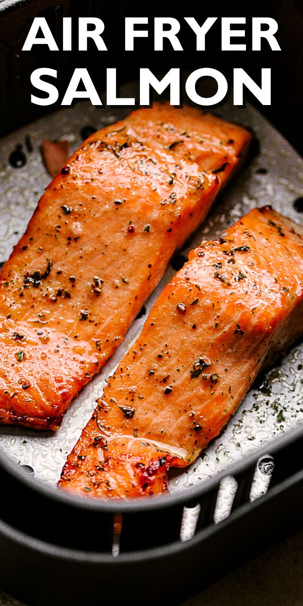 two salmons cooking in a frying pan with the words air fryer salmon