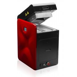 a red and black machine with its lid open on a white surface, in front of a white background