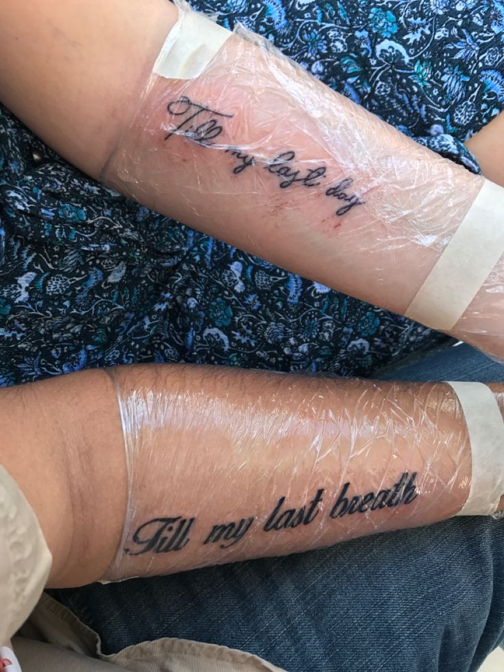 two people with bandages on their arms and one has the words, i'm my last health