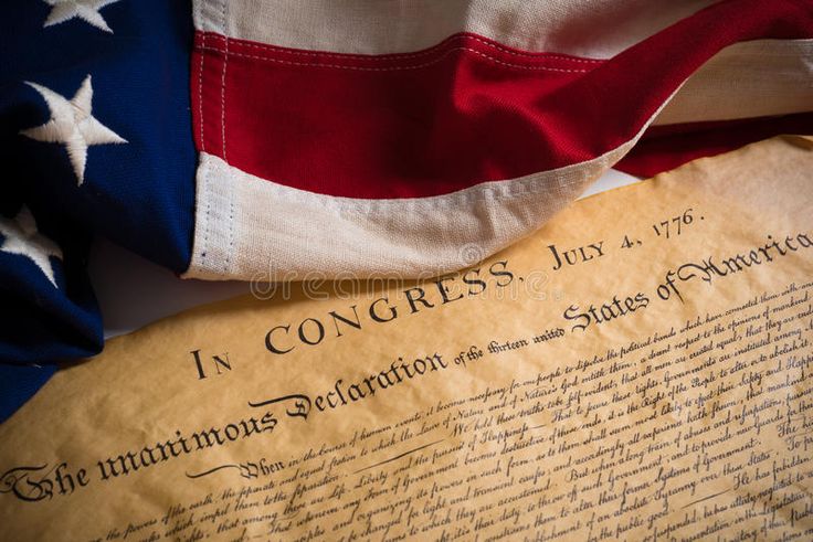 an american flag and the declaration of the united states