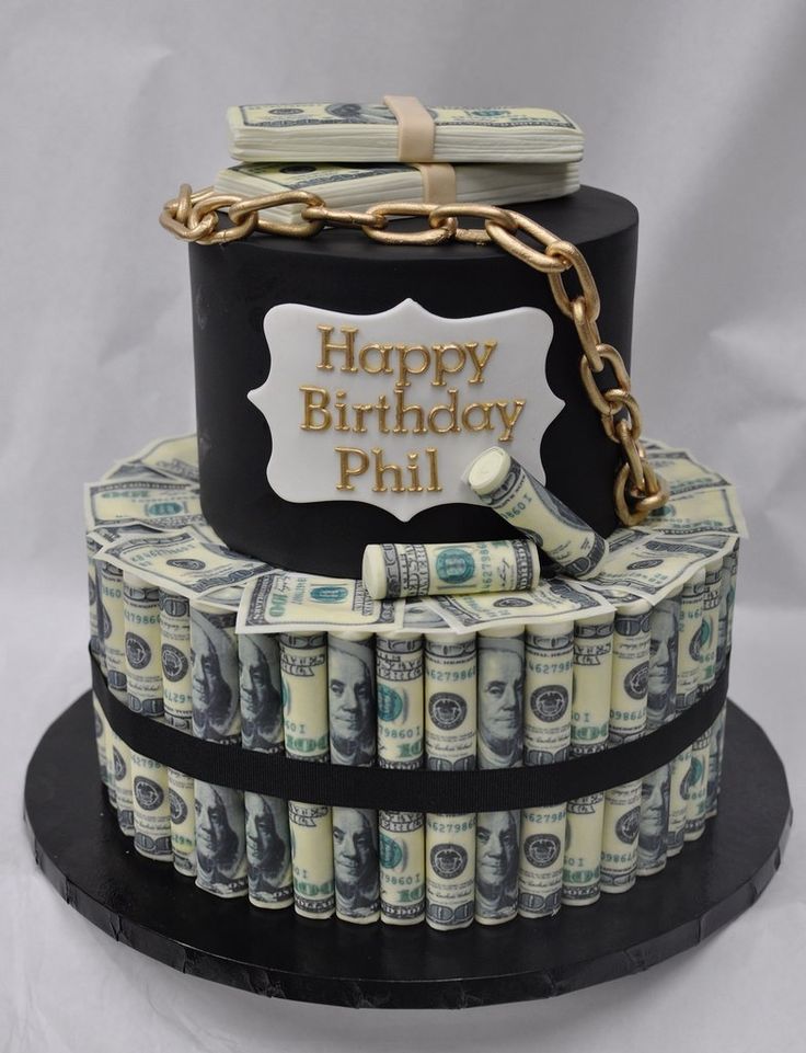 a birthday cake made out of money with the words happy birthday phil on it