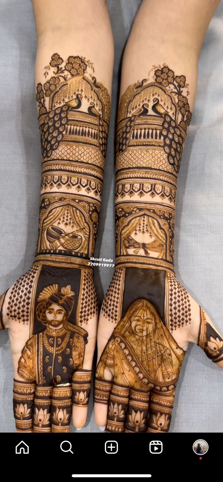 two hands with henna designs on them