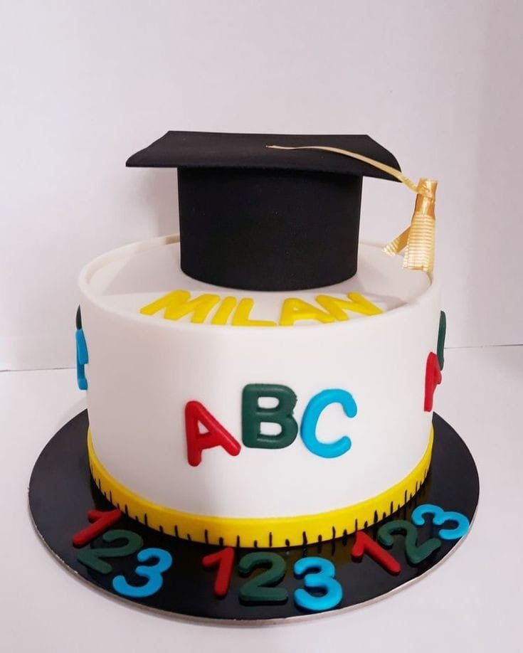 a cake with a graduation cap and ruler on top that says abc 4, 423