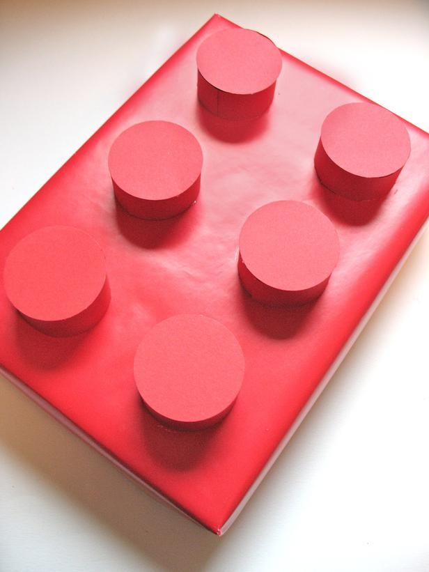 a red tray with six circles on it