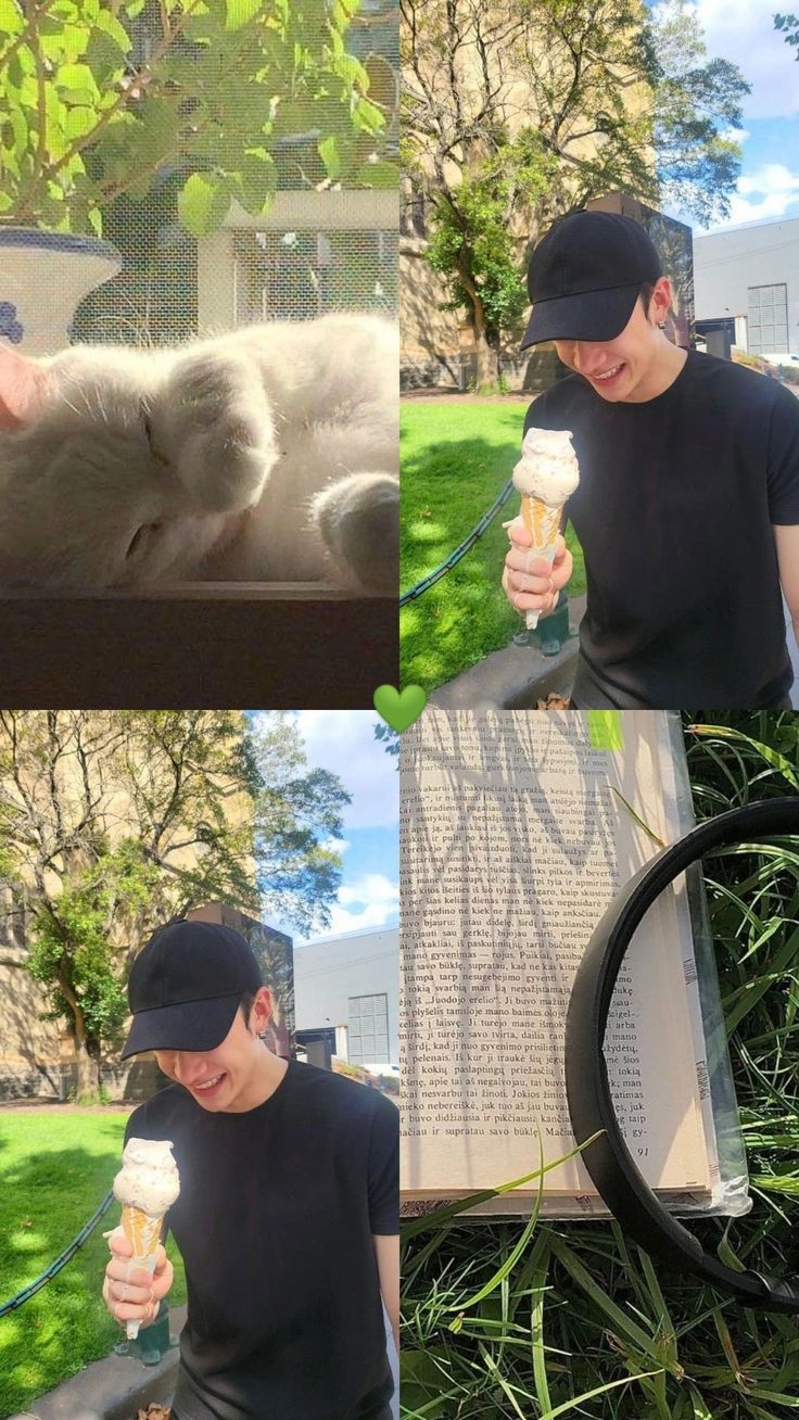 a man holding a cup while standing next to a cat