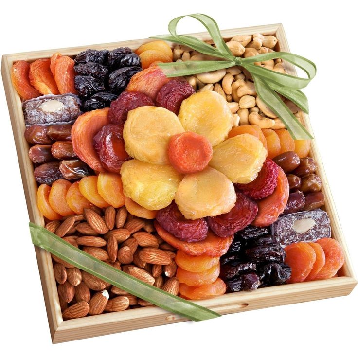 a wooden box filled with dried fruits and nuts