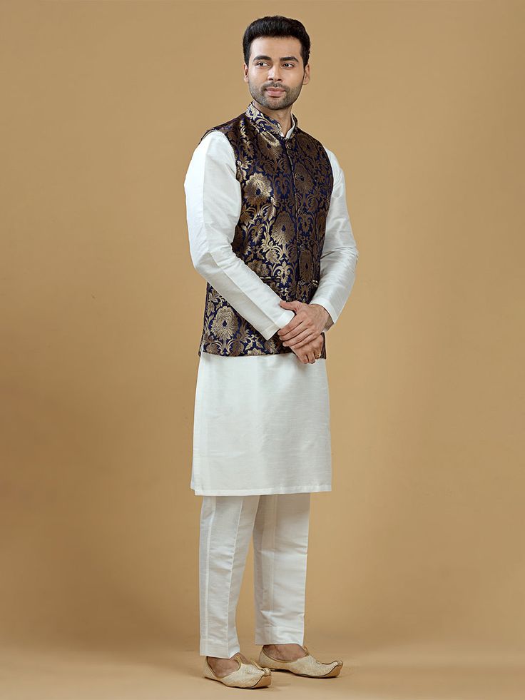 A gold zari brocade vest to pair with any kurta with statement button closures at the front. Occasion: Style this vest with pajama pants and a kurta for a welcome dinner or sangeet night, or style it with a any dress shirt and trousers for a sleek Indian wedding reception look! WASH CARE INSTRUCTIONS - Please Dry clean only. Slight color variation is possible due to digital photography. **Kurta & Pajama not included Brocade Nehru Jacket For Diwali Designer Wear, Bollywood Brocade Nehru Jacket For Festive Occasions, Bollywood Brocade Nehru Jacket For Designer Wear, Sleeveless Traditional Sets For Formal Occasions, Diwali Brocade Nehru Jacket For Designer Wear, Diwali Designer Brocade Nehru Jacket, Gold Nehru Jacket For Festivals, Straight Kurta Style, Traditional Sleeveless Nehru Jacket For Festive Occasions, Festive Nehru Jacket With Brocade And Pallu