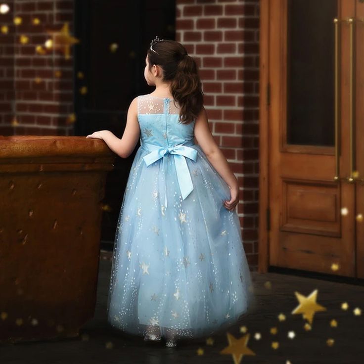 This gown will have all eyes on her! Stunning layers of light blue tulling graced with a sweet, delicate sparkle star print, your girl will be spinning with excitement! Fully lined with soft cotton and lots of built in poof, this gown is both stunning and comfortable. Self ties and fully washable! Light Blue Princess Gown For Dress-up, Fitted Light Blue Tulle Princess Dress, Blue Glitter Tulle Ball Gown, Light Blue Tulle Ball Gown For Pageant, Princess Style Light Blue Tulle Ball Gown, Light Blue Tulle Ball Gown For Dress-up, Light Blue Tulle Gown For Dress-up, Light Blue Princess Style Tutu Dress For Dress-up, Blue Glitter Tulle Ball Gown Dress