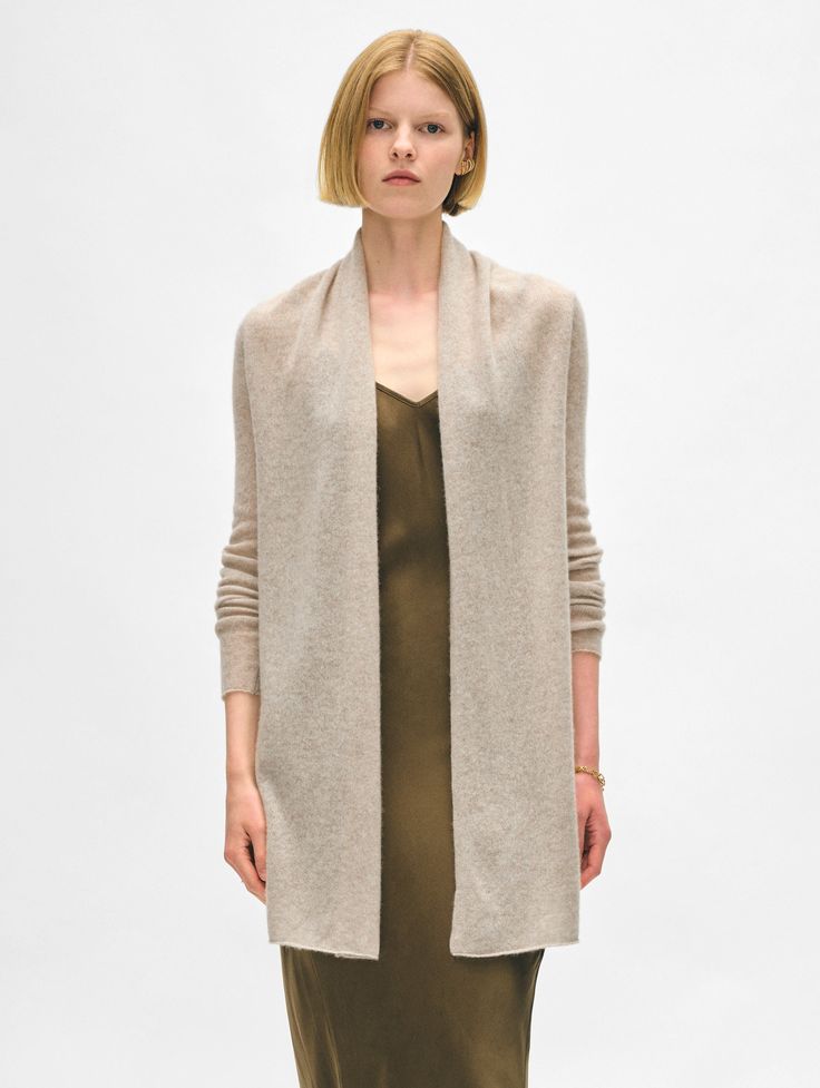 The longest-running piece at White + Warren, the Cashmere Trapeze Cardigan is a chic fingertip-length open sweater that works on every body type. No matter what color you choose, you'll want to wear this timeless style season after season. Details Straight fit. Long sleeve. Length in size small is 32.5" The model is 5'9" and is wearing a size small. 100% Cashmere Hand wash cold or dry clean. Do not twist or wring. Reshape and lay flat to dry. Warm iron if needed. Style #11092 Open Sweater, Timeless Style, You Choose, Lay Flat, Body Types, Timeless Fashion, Cashmere, Matter, Dry Clean