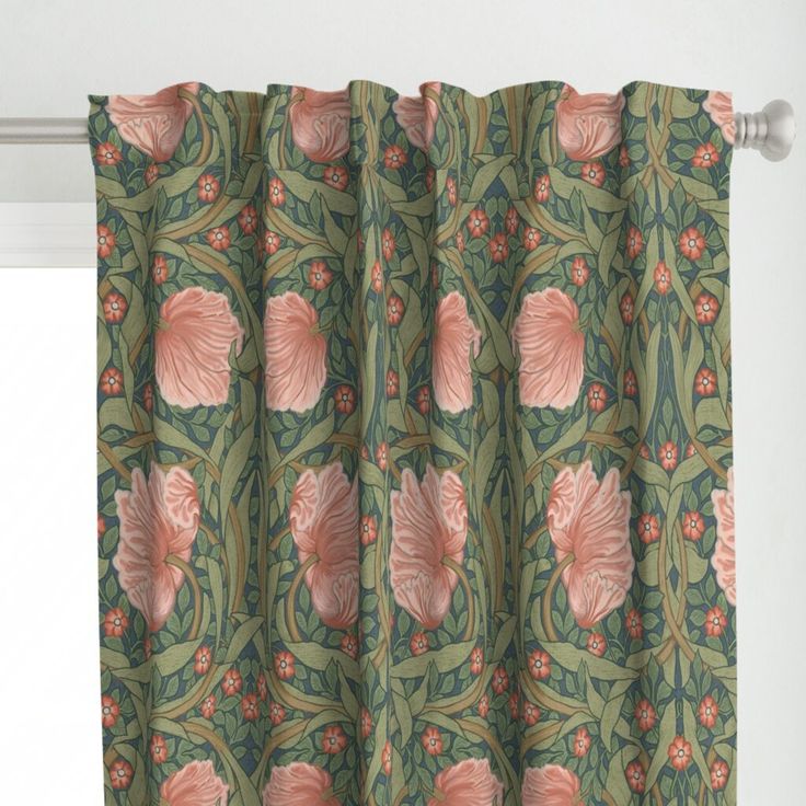 a green curtain with pink flowers on it