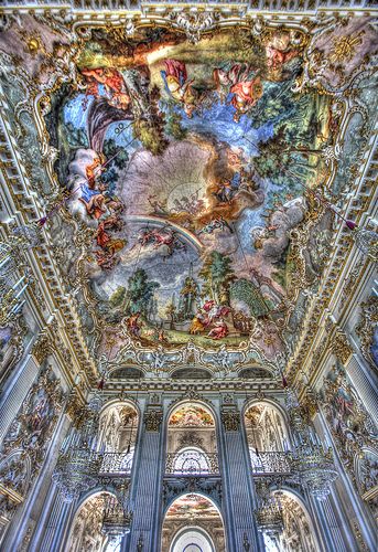 an ornate ceiling with many paintings on it