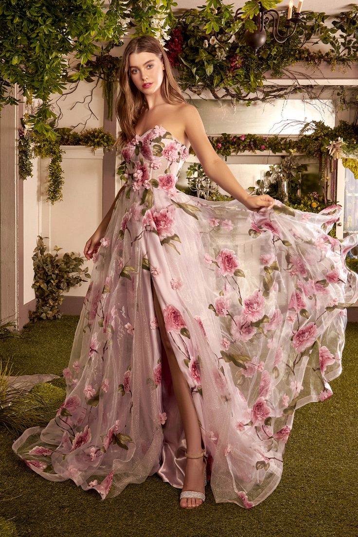 RESTOCK ETA 05/30 - 06/10All the nuances of spring stunningly captured in a single gown. Our beautiful peony gown features a soft floral print amidst layers of rose and metallic chiffon for an extra touch of elegance. This full length dress features a corset style bodice with 3D floral details and zipper enclosure on b فستان زهري, Floral Dress Wedding Guest, Strapless Organza, Cheap Prom Dresses Online, Rose Gown, Silk Prom Dress, Formal Wedding Guests, Organza Gowns, Floral Dress Formal