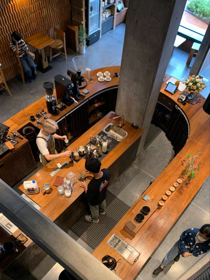 an overhead view of people preparing food in a restaurant