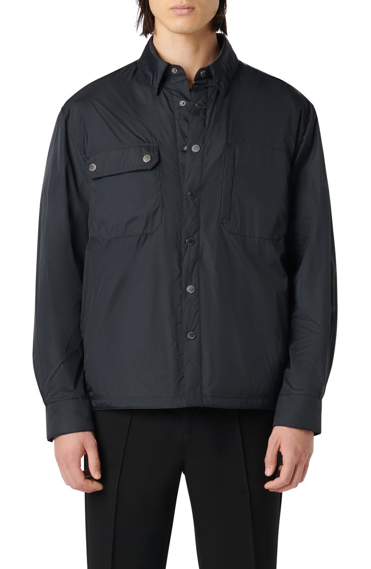 Water-resistant nylon brings durability to this relaxed shirt-jacket that boasts both side-seam and chest snap-flap patch pockets. 25" length Front snap closure Spread collar Chest snap-flap patch pockets; side-seam pockets Partially lined Water-resistant 100% nylon Dry clean Imported Outdoor Button-up Shacket With Flap Pockets, Utility Shacket With Button Closure For Outdoor Use, Nylon Outerwear With Patch Pockets For Work, Outdoor Utility Shacket With Button Closure, Casual Nylon Outerwear With Button Closure, Outdoor Nylon Outerwear With Button Closure, Nylon Outerwear With Button Closure For Outdoor, Button-up Outdoor Outerwear With Flap Pockets, Outdoor Button-up Outerwear With Flap Pockets